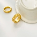 Macro detail of gold titanium steel ring with three-dimensional geometric triangle pattern - Wide Triangle Cut 0.7cm