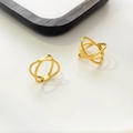 Detailed close-up of 18K gold plated stainless steel hollow geometric crisscross rings - Double Interlocking Rings