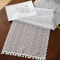 White geometric hollow lace table runner with elegant pompom fringe on dark wood - 35x91cm / Triangle Stripe 2