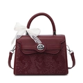 Burgundy Kelly style handbag with snakeskin pattern, silver lock, and lace bow accent - Burgundy