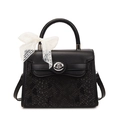 Chic black faux leather handbag with snakeskin texture, silver lock, and white lace bow - Black