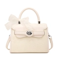 Cream PU leather crossbody bag with snake texture, twist lock, and lace bow decoration - White