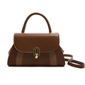 Caramel brown leather handbag with contrast textures and golden oval turn-lock closure - Brown