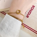 Three-layer 18K gold plated punk style chain bracelet with K18 tag worn on wrist - 3-Layer Circle Bracelet-Gold