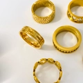 Detailed collection of five gold-plated 18K titanium steel rings with hollow gear patterns - US 6 / Cross Engraved