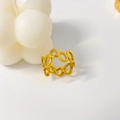Detail of 18K gold-plated titanium steel ring with hollow gear link chain design - US 6 / Hollow Circle Design