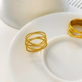 Macro detail of multi-layered gold textured ring with hammer finish on ceramic base - US 6 / Multi-Layer Cross Texture Style / Gold