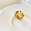 Detail shot of a wide gold honeycomb hollow pattern ring in polished stainless steel - US 6 / Honeycomb Hollow Style / Gold