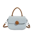 Minimalist light blue checkered crossbody bag with brown handle and large round buckle - Blue