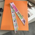 Macro shot of silk-style checkered scarf with France-Paris motif on orange gift box - 5*85cm / Pink (France-Paris Print)