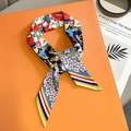 Floral print satin twilly silk scarf tied in a bow on a gift box background - Navy Blue and Red