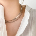 Detail of silver double-layered snake and bead chain necklace worn on the collarbone - Double Layer Snake Bone & Rice Bead Style / Steel