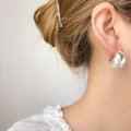 Polished silver teardrop earrings for women shown as a minimalist stud on model's ear - Hollow Thick Moon / Electroplated Silver