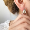 Minimalist silver-toned titanium steel teardrop stud earrings with a high-polished mirror finish - Teardrop Large / Steel