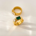 Macro shot of titanium steel rings featuring green emerald-cut zircon and brushed finish - US 6 / Green Rectangular + Round Zirconia