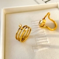 Detail of 18K gold plated titanium steel rings with marquise zircon in a luxury jewelry box - Spiral Double Zircon