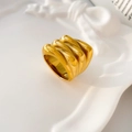 Close-up of a wide 18K gold-plated stainless steel ring with wavy croissant texture - US 6 / Croissant Wave Pleated Style (Wide Surface)