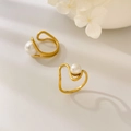 Detail of gold teardrop rings with white pearls and curved minimalist double layers - US 6 / Curved Wave Pearl