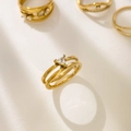 Close-up of a double-layered 18K gold-plated ring with a triangular zircon stone - Small / Triangle Design Zirconia