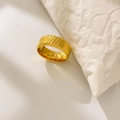 Macro shot of 18K gold plated titanium ring featuring diagonal textured groove details - US 6 / Twill Weave