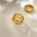 Detailed view of hollow infinity line and 18K gold plated steel rings with soft shadows - US 6 / Symmetrical Figure-Eight Hollow