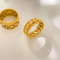 Macro detail of 18K gold plated ring featuring hollow geometric lines and coin patterns - US 6 / Multi-Circle Style