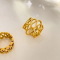 Detail of 18K gold plated hollow infinity loop rings with polished finish and open design - US 6 / Asymmetrical Figure-Eight Hollow