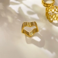 Detailed view of three 18K gold plated titanium rings with heart and wavy hollow designs - US 6 / Bent Three-Line Hollow