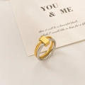 Close-up of dual-tone interlocking gold and silver rings with a geometric metal buckle - US 6 / Gold Steel Double Plain Loop