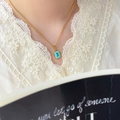 Close-up of a vintage 18K gold plated necklace with a rectangular blue zircon pendant - Square Blue Zirconia
