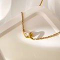 Macro view of pear-cut zircon pendant on an 18K gold plated stainless steel snake chain - Water Drop Shape Zirconia
