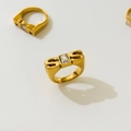 Detailed view of 18K gold plated rings with engraved MOM and S letters and cubic zirconia - US 6 / SIS Letter Style