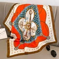 Close-up of elegant square silk scarf with vintage key and chain patterns on grey leather - 70x70cm / Red with Coffee Border