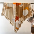 Large floral silk square scarf in khaki and orange draped on a minimalist hanger - 90*90cm / Khaki Beige