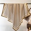 Close-up of vintage silk scarf featuring ivory monogram print and gold chain patterns - 90*90cm / Khaki