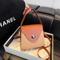 Brown textured box bag with wavy flap, contrast paneling and silver metallic buckle - Khaki