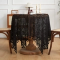 Detail of black crochet lace tablecloth with floral hollow patterns and tassel fringe edge - Black / 60x60cm