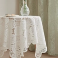 Detailed close-up of white floral lace tablecloth with scalloped edges on round table - 60x60cm / White
