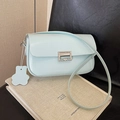 Light blue minimalist crossbody square bag with silver buckle on textured book - Blue