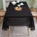 Detail of black cotton linen tablecloth featuring retro geometric hollow patterns and tassels - 140*100cm / Black