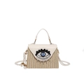 Stroh-Handtasche in Beige mit großem Perlen-Augendesign und Seilschultergurt - Gebrochenes Weiß