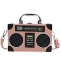Pink vintage radio crossbody bag with retro speaker details and a silver handle - Pink