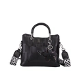 Black woven textured tote bag with a patterned strap and floral leather charm - Black