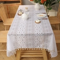 White bohemian lace tablecloth with fringe edges and geometric floral patterns - White Torch Flower
