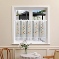 White cafe curtain with colorful leaf embroidery and ruffled hem in bright home setting - 60*230