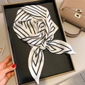 Elegant black and white striped silk scarf tied in a bow on a black display tray - Minimalist Diagonal Stripes Beige (FX-74-1 Beige)