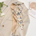Elegant champagne silk skinny scarf with floral print tied on a beige blazer lapel - CT-424-Beige