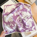 Detail of silk square scarf showing purple floral butterfly print and rolled hem edge - 53*53cm / Taro Purple