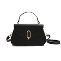 Elegant black leather handbag with a gold oval lock and shoulder strap on white background - Black