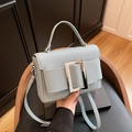 Light grey blue pebble grain leather handbag with silver metal buckle and shoulder strap - Blue